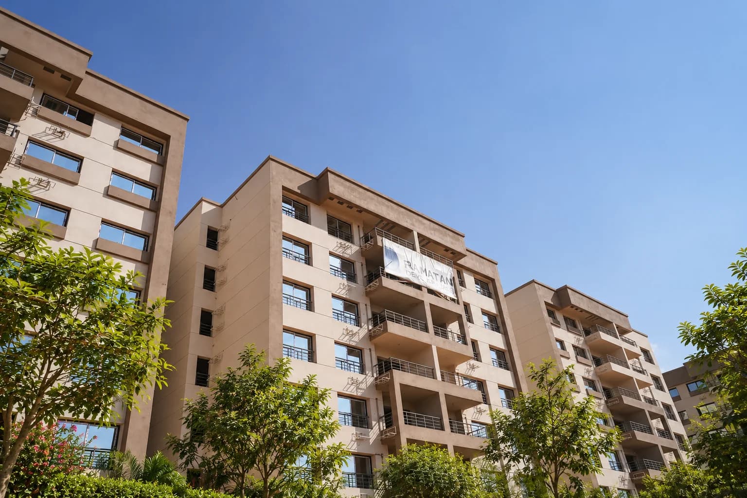 Modern residential building facades showcasing panoramic balconies and refined architecture.