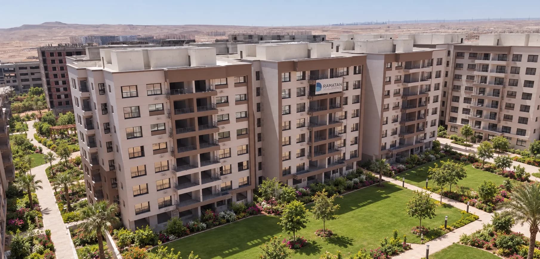 Scenic garden promenade with outdoor lighting accents throughout the residential zone.